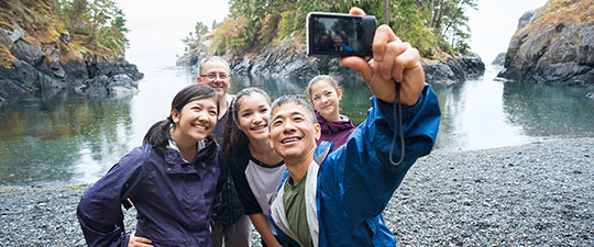 Family hiking on vacation taking selfie